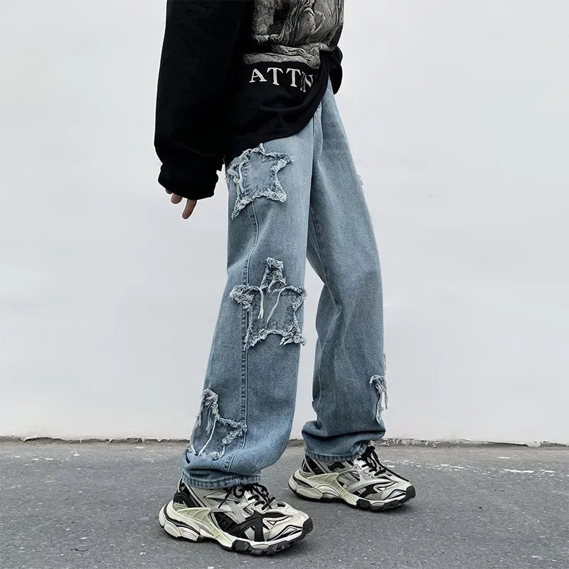 Star ripped denim jeans with chunky sneakers, modern streetwear style