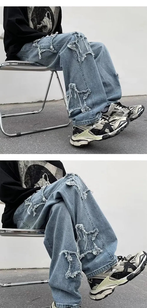 Distressed wide-leg jeans with star rips paired with chunky sneakers for casual streetwear style