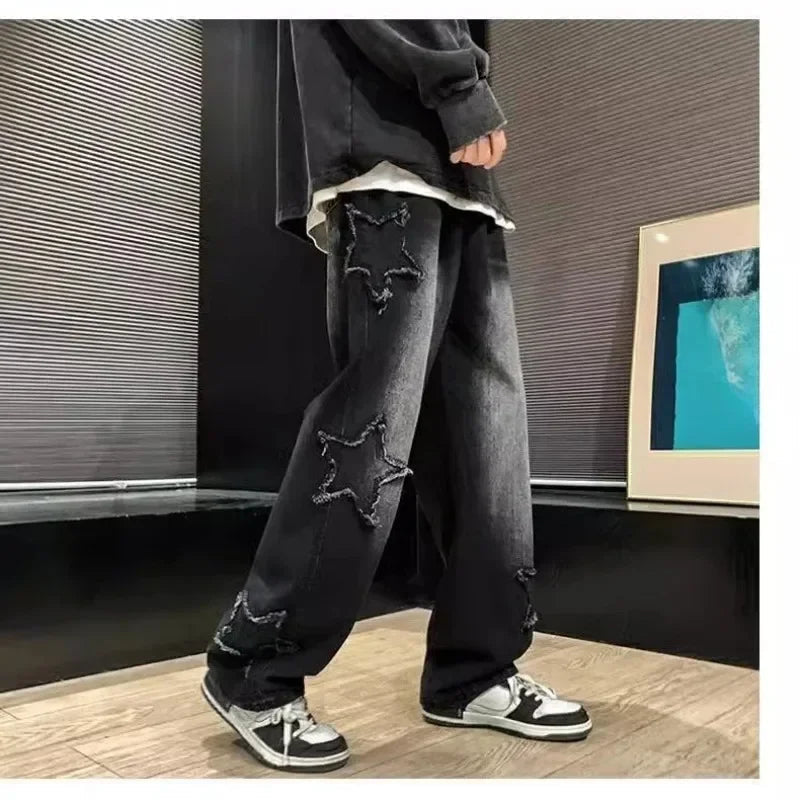 Black star-embroidered ripped jeans with sneakers, modern streetwear style