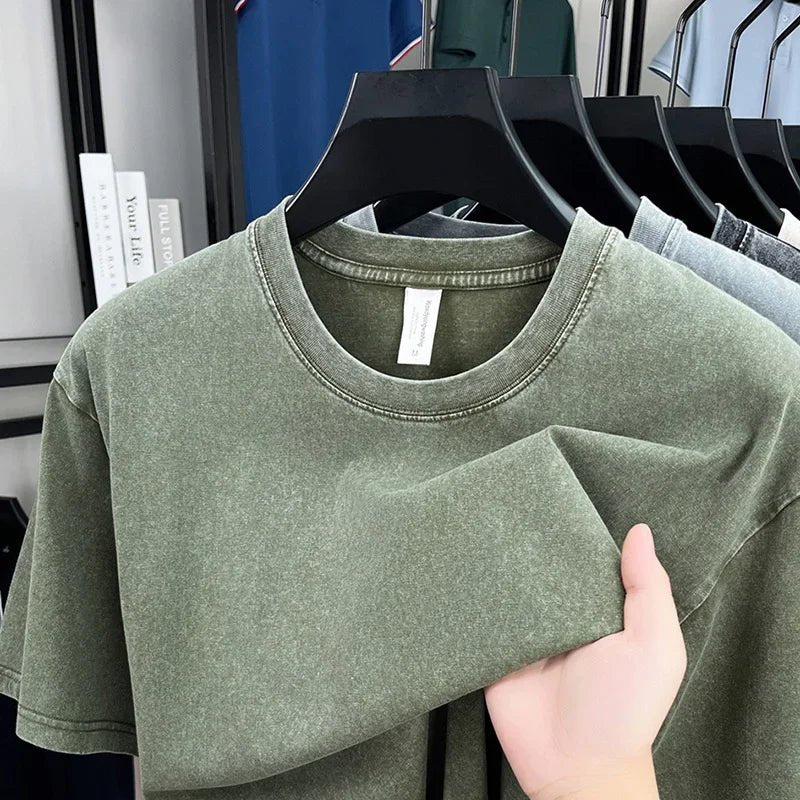 Olive green oversized t-shirt on black hanger, soft cotton fabric, modern casual style